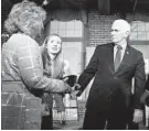  ?? CHARLES KRUPA/AP ?? Former Vice President Mike Pence meets with people Wednesday in Manchester, New Hampshire.