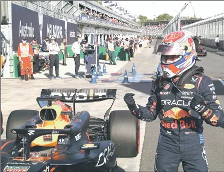  ?? — AFP photo ?? Verstappen gestures as he celebrates achieving pole position, in the qualifying session of the Formula One Australian Grand Prix at the Albert Park Circuit in Melbourne.