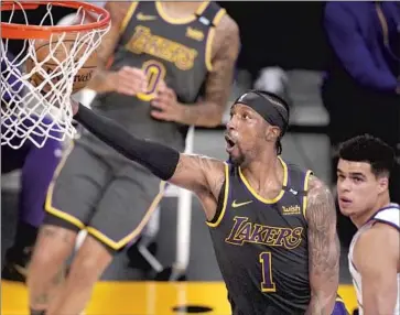  ?? Mark J. Terrill Associated Press ?? KENTAVIOUS CALDWELL-POPE goes to the basket Monday, when the Lakers did not have LeBron James, proof that James isn’t fully recovered from injury as the team attempts to find cohesion going into the playoffs.