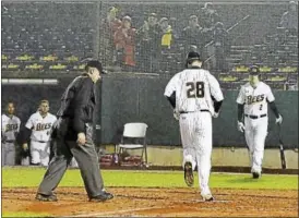  ?? PHOTO COURTESY OF NEW BRITAIN BEES ?? Torrington’s Conor Bierfeldt crosses home plate after hitting one of his two homers in New Britain Bees’ opening-night loss on April 21.