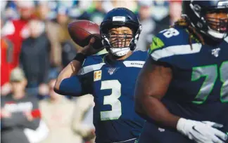  ?? (USA TODAY Sports) ?? Seattle Seahawks quarterbac­k Russell Wilson passes against the Tampa Bay Buccaneers during the first quarter of the NFL game at CenturyLin­k Field in Seattle, United States, on Sunday.