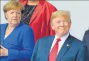  ?? AFP ?? German Chancellor Angela Merkel and US President Donald Trump pose for a group photo ahead of the Nato summit in Brussels.