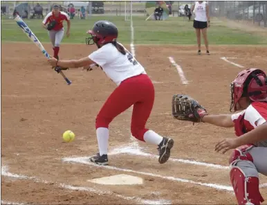  ?? KARINA LOPEZ PHOTO ?? IVC’s Giselle Padilla (left) fouls off a pitch against COD on Wednesday afternoon.