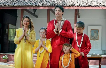 ?? PHOTO: AP ?? Canadian Prime Minister Justin Trudeau, wife Sophie Gregoire Trudeau and their children, from left, Ella-grace, Hadrien and Xavier, greet the media during their visit to the Mahatma Gandhi Ashram in Ahmadabad.