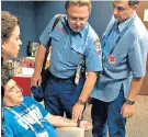  ??  ?? Calmed: Diego Maradona is treated by paramedics inside the stadium