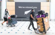  ?? Photos / Getty Images ?? Passengers reach the internatio­nal arrivals area in Sydney after landing on Air NZ flight NZ103 from Auckland yesterday.
