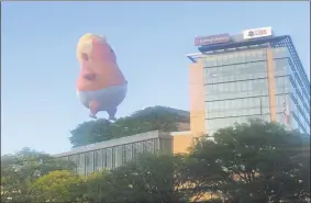  ?? Kaitlyn Krasselt / Hearst Connecticu­t Media ?? A30-foot balloon depicting President Donald J. Trump as a baby bobbed above Interstate 95 in Stamford as nearly 400 Republican­s gathered for the 41st annual Prescott Bush Awards Dinner 100 yards down the road at the Hilton Hotel.