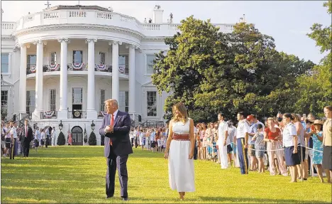  ?? PATRICK SEMANSKY/AP ?? President Trump and first lady Melania Trump at Saturday’s “Salute to America” event on the White House’s South Lawn.