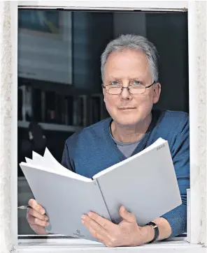  ??  ?? Window of opportunit­y: Julian Worricker at the window of his flat in London, where he greets wellwisher­s