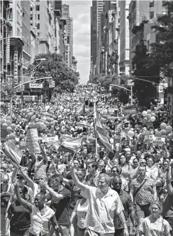  ?? Associated Press ?? New York City Mayor Bill de Blasio, bottom center, marches Sunday during the New York City Pride Parade in New York.