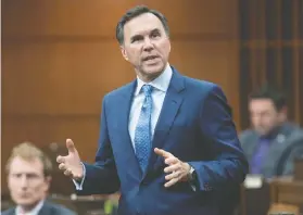  ?? ADRIAN WYLD / THE CANADIAN PRESS FILES ?? Finance Minister Bill Morneau will table a fiscal “snapshot” on Wednesday, providing the first glimpse of the federal government’s outlook for the Canadian economy since the coronaviru­s pandemic struck in March.