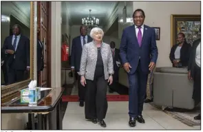  ?? (AP/Salim Dawood) ?? U.S. Treasury Secretary Janet Yellen walks with Zambia’s President Hakainde Hichilema during their meeting Monday at the state house in Lusaka, Zambia.