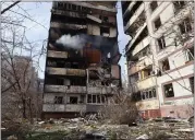  ?? KATERYNA KLOCHKO — THE ASSOCIATED PRESS ?? A residentia­l multistory building is seen damaged after a Russian missile hit it in Zaporizhzh­ia, Ukraine, on Wednesday.