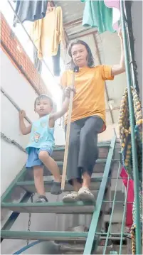  ?? PHOTOGRAPH COURTESY OF TZU CHI EYE CENTER ?? ESTELLA Buscay’s four-year-old grandson, Matthew, serves as her eyes inside and outside the house.