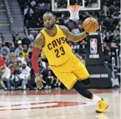  ?? BRETT DAVIS/THE ASSOCIATED PRESS ?? Cleveland Cavaliers forward LeBron James drives to the basket against the Atlanta Hawks on Friday in Atlanta.