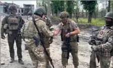  ?? PRIGOZHIN PRESS SERVICE VIA AP ?? In this grab taken from video released by Prigozhin Press Service on Saturday, May 20, 2023, Yevgeny Prigozhin, the owner of the Wagner Group military company shakes hands with his soldiers, in Bakhmut, Ukraine.