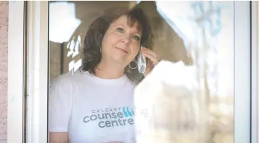  ?? CHRISTINA RYAN ?? Working from her makeshift office at home, Cathy Keough, director of counsellin­g initiative­s with the Calgary Counsellin­g Centre, reminds people that during the pandemic it’s more important than ever that people care for their mental health.