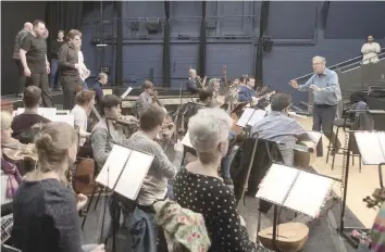  ?? — AFP ?? British composer Sir John Eliot Gardiner conducts the orchestra during a rehearsal session at Sadler’s Wells Theatre in London.
