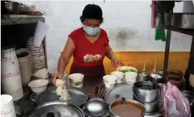  ?? Chi Hui Lin/The Guardian ?? Taiwanese woman Mama Lai at her noodle stall in Taipei, where prices are rising in line with costs in many Asian countries. Photograph: