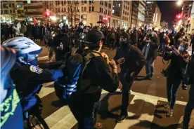  ?? Photograph: Anadolu Agency/ Getty Images ?? Proud Boys and Antifa activists square up in Washington.