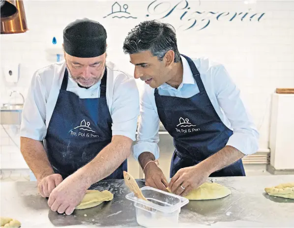  ?? ?? Rishi Sunak is taught how to make a pasty by an expert in north Cornwall during his tour of the South West of England to meet Conservati­ve Party members