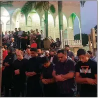  ?? AP/MARK GOUDKAMP ?? Worshipper­s at the Lakemba Mosque in Wakemba, New South Wales, Australia, pray for victims and families of the Christchur­ch, New Zealand, shootings during an evening vigil Friday.