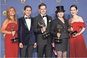  ??  ?? “(The Emmy) is just icing. A lovely icing,” Amy Sherman-Palladino, second from right, said after “The Marvelous Mrs. Maisel” won the comedy series Emmy.