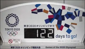  ?? JAE C. HONG / AP ?? A countdown display for the 2020 Tokyo Olympics will have to be changed after the Games were postponed until 2021Tuesda­y because of the COVID-19 outbreak.