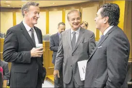  ?? RALPH BARRERA / AMERICAN-STATESMAN ?? University of Texas System Chancellor Bill McRaven (from left), Texas A&M University System Chancellor John Sharp and Texas State University Chancellor Brian McCall talk before a hearing in April. The UT and A&M systems are part of a consortium seeking...