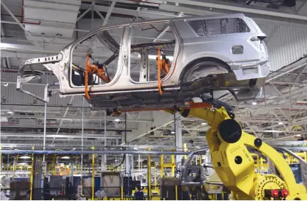  ??  ?? A LARGE ROBOT nicknamed “Kong” lifts the body of a Ford Expedition SUV at Ford’s Kentucky Truck Plant as the no. 2 US automaker ramps up production of two large SUV models in Louisville, Kentucky, US, Feb. 9.