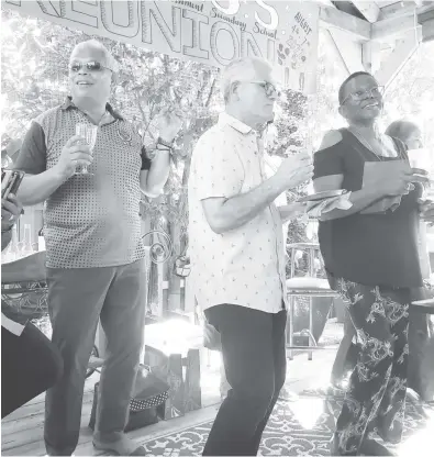  ?? ?? Unable to resist the music are David Sears, Paul Gomes and Janice Perreira at a reception at the Prashad’s residence