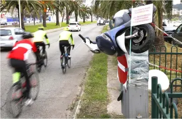  ??  ?? Bicycles ride past a speed camera trashed in Ajaccio on the French Mediterran­ean Island of Corsica, a day after a third nationwide day of demos by the yellow vests. — AFP photo