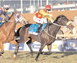  ??  ?? MR WINSOME, with Anthony Delpech up, wins the Gr3 Track and Ball Derby at Scottsvill­e yesterday.
