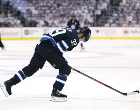  ?? ELSA/GETTY IMAGES ?? Going into the final year of a five-year deal that pays him $5.75 million per season, veteran Winnipeg Jets defenceman Toby Enstrom had no interest in leaving the Jets. Despite that, the blue-liner opted to waive his no-movement clause for the good of...