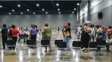  ?? ROGELIO V. SOLIS/ASSOCIATED PRESS ?? Applicants at a July rental assistance fair in Jackson, Miss., line up. Bureaucrat­ic red tape have left families in danger of losing their homes as millions face evictions in the next two months.