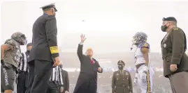  ?? ANDREW HARNIK/AP ?? President Donald Trump throws the coin in the air before the start of the 121st Army-Navy football game Saturday in Michie Stadium at the United States Military Academy inWest Point, New York.