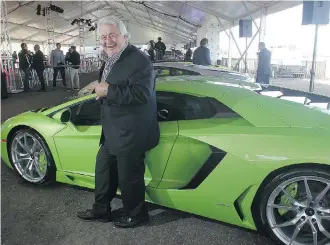  ?? Ted Rhodes/calgary Herald ?? Developer Ken Mariash stands among the luxury cars at the launch of new Meadows Mile auto mall.