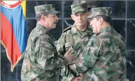  ?? Fernando Vergara
Associated Press ?? GEN. Juan Pablo Rodriguez Barragan, right, commander of Colombia’s armed forces, is among those who reportedly knew about the extrajudic­ial killings.
