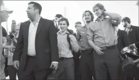  ?? Penticton Herald file photo ?? Returning home from winning the RBC Cup are Penticton Vees coach Fred Harbinson, along with players, from left, Cody DePourcq, Logan Johnston and Michael Garteig.