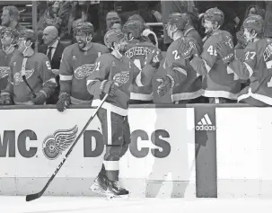  ?? PAUL SANCYA/AP ?? Dylan Larkin celebrates his empty-net goal against the Islanders at Little Caesars Arena on Thursday.