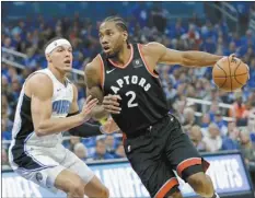  ?? AP photo ?? Toronto’s Kawhi Leonard drives against Orlando’s Aaron Gordon during the first half in Game 4 of their firstround playoff series Sunday.