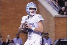  ?? CHUCK BURTON — THE ASSOCIATED PRESS ?? North Carolina quarterbac­k Drake Maye (10) looks to pass against Wake Forest during the first half of an NCAA college football game in Winston-Salem, N.C., Saturday, Nov. 12, 2022.