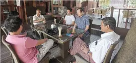  ??  ?? Customers enjoying their drinks at a coffee shop in downtown Yangon, one of around two dozen specialty coffee shops that have opened up in Myanmar’s biggest city. —AFP photos