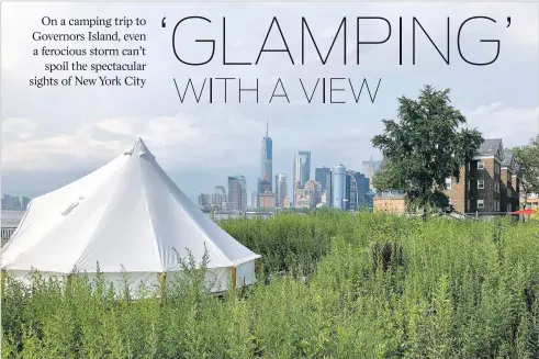  ?? ROBIN MARTIN/THE NEW MEXICAN ?? A weedy field and canvas tents, with a spectacula­r view across New York Harbor, greet campers on Governors Island.