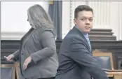  ?? SEAN KRAJACIC — THE KENOSHA NEWS VIA AP ?? Kyle Rittenhous­e, right, looks on as the jury is let out of the room during a break during his trail at the Kenosha County Courthouse in Kenosha, Wis., on Monday.