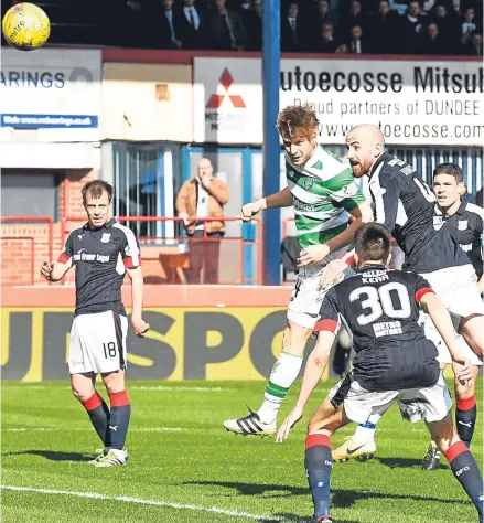  ??  ?? Former Dundee United midfielder Stuart Armstrong heads home Celtic’s second goal.