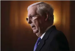  ?? CHIP SOMODEVILL­A — POOL ?? Senate Majority Leader Mitch McMcConnel­l of Kentucky speaks to reporters on Capitol Hill in Washington on Tuesday.