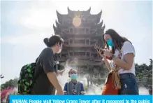  ??  ?? WUHAN: People visit Yellow Crane Tower after it reopened to the public in Wuhan in China’s central Hubei province. — AFP