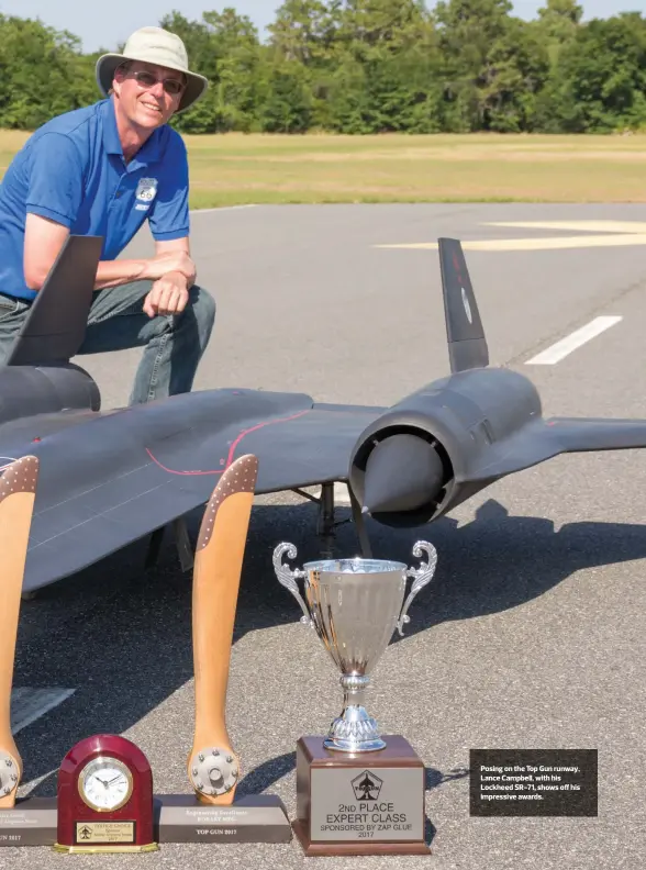  ??  ?? Posing on the Top Gun runway, Lance Campbell, with his Lockheed SR-71, shows off his impressive awards.