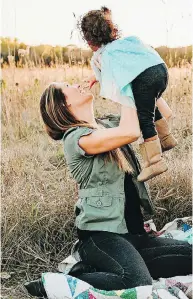  ?? CHRYSTIE FITCHNER / THE CANADIAN PRESS ?? Chrystie Fitchner holds one of her daughters. She says she has lived outside Canada for several years.